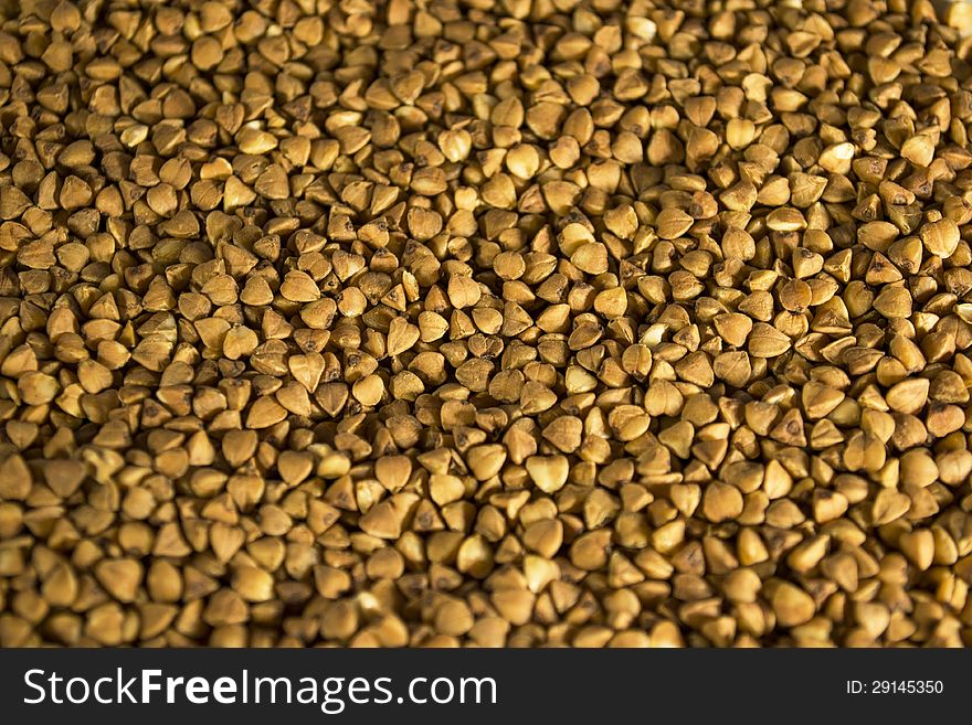 Brown buckwheat texture closeup background