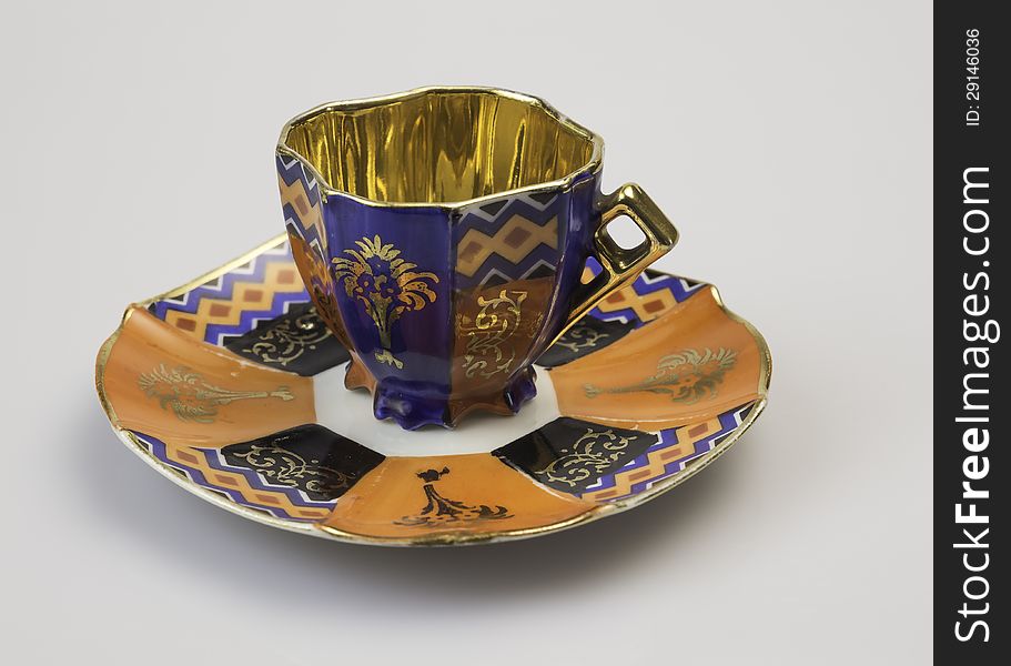 The historic, decorated porcelain cup for drinking tea. The historic, decorated porcelain cup for drinking tea.