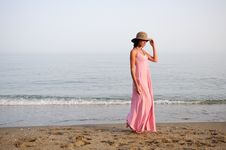 Beautiful Woman With Long Pink Dress On A Tropical Beach Royalty Free Stock Photography