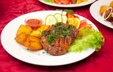 Grilled Beefsteak, Baked Potatoes And Vegetables Stock Image