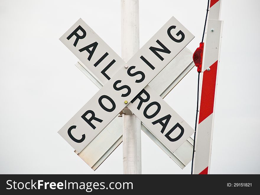 Railroad crossing sign with gate up. Railroad crossing sign with gate up.