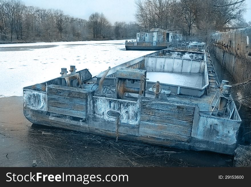 Old used ark in a frozen dock on the river. Old used ark in a frozen dock on the river