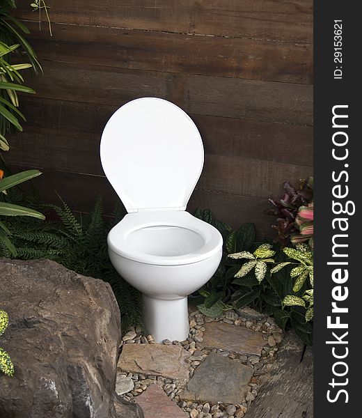 The white toilet in the garden. The white toilet in the garden