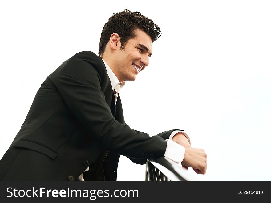 Portrait of a young businessman in urban background
