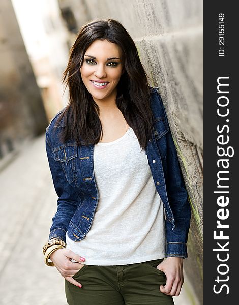 Young beautiful woman in a urban background