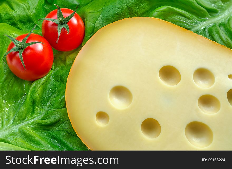 Swiss cheese , tomatoes and green salad. Swiss cheese , tomatoes and green salad