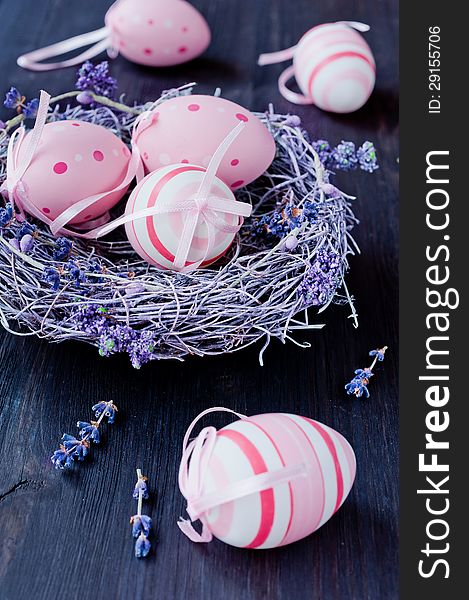 Easter eggs in a nest with lavender flowers. Easter eggs in a nest with lavender flowers