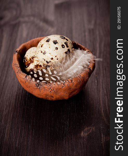 Quail eggs in a rustic bowl