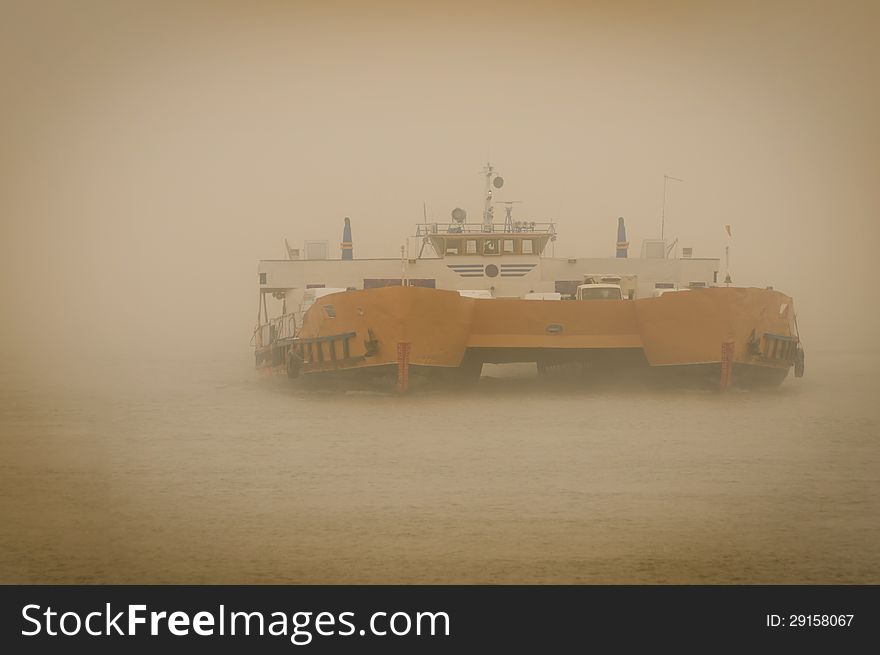 Car carrier ship in fog .