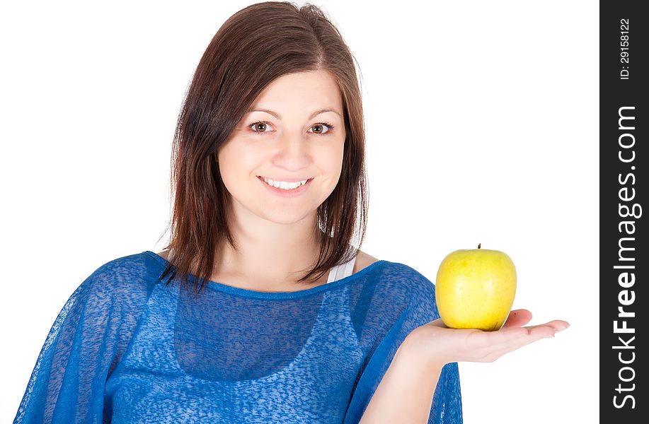 Beautiful young woman with green apple over white background.