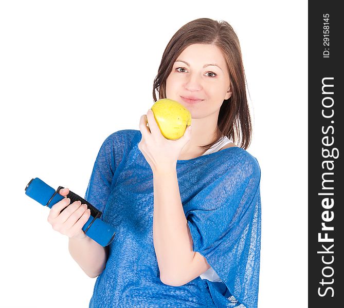 Beautiful young woman with green apple over white background.