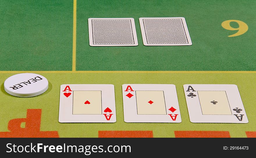 Poker cards and dealer button on the table.