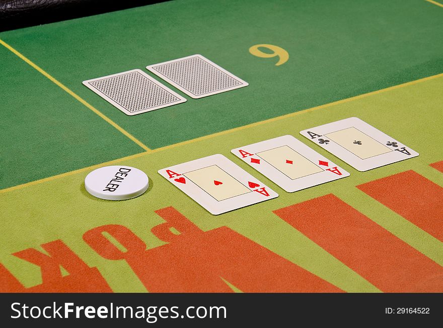 Poker cards and dealer button on the table.