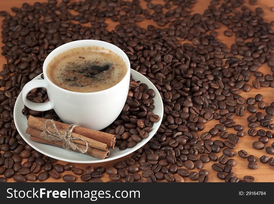 Cup of coffee espresso with cinnamon sticks. Cup of coffee espresso with cinnamon sticks