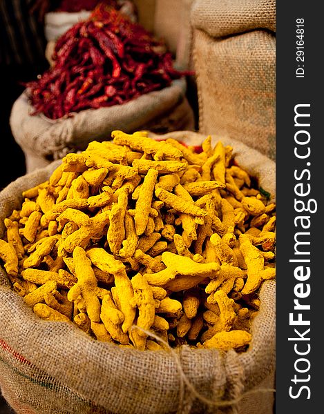 Red chili and yellow curcuma on a market