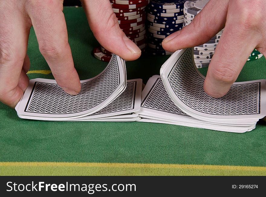 Poker player give the cards a shuffle