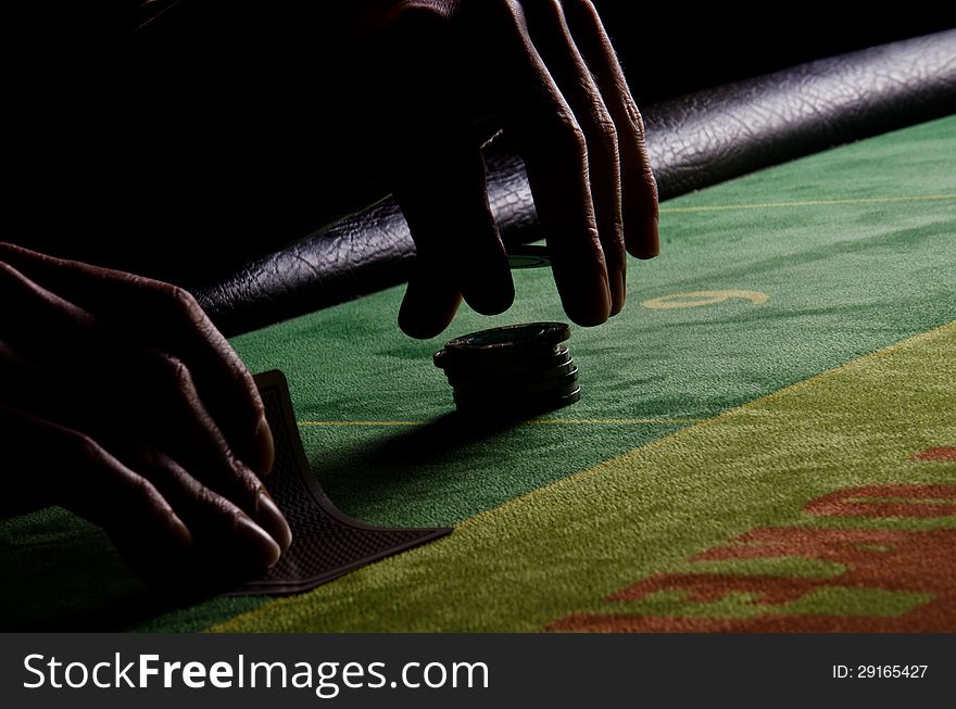 Poker Player In Back-light.