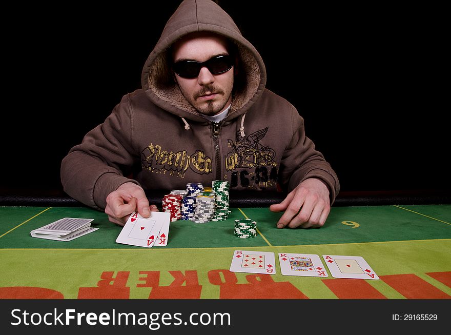 Poker player is showing his cards because he won. Poker player is showing his cards because he won.