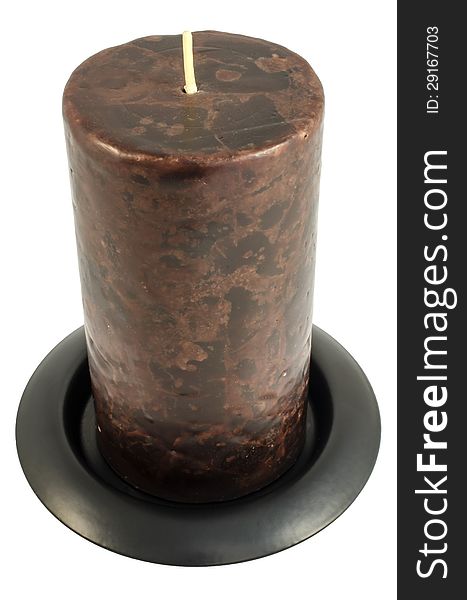 Dark candle stands on a circular base