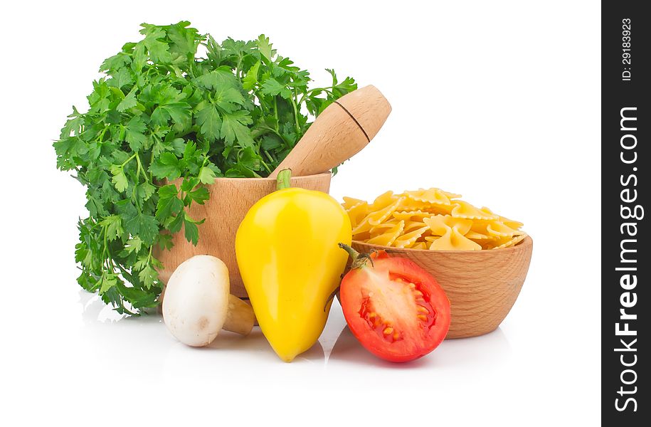 Wooden mortar with parsley, vegetable and pasta, food ingredient photo. Wooden mortar with parsley, vegetable and pasta, food ingredient photo