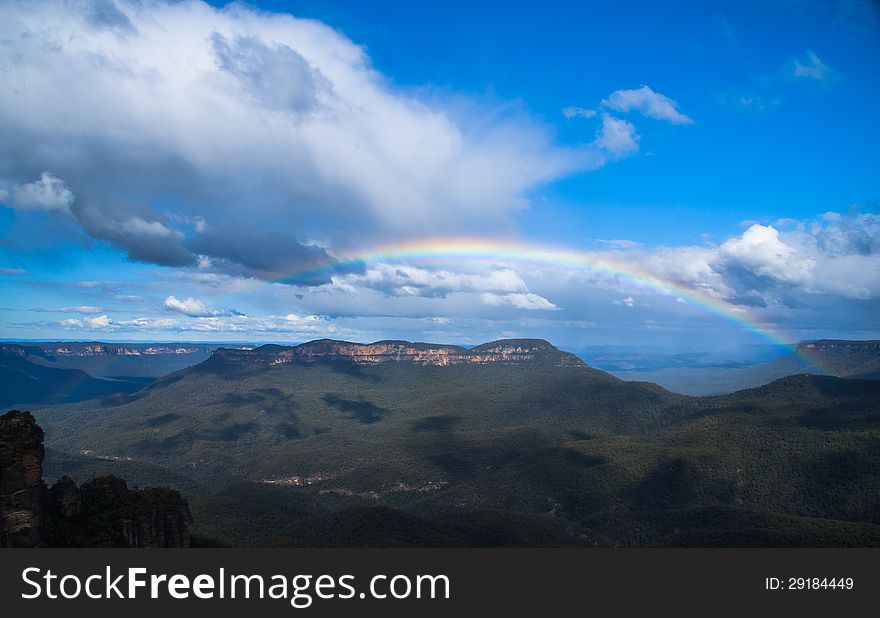 Landscape Rainbow And Green Mountains.