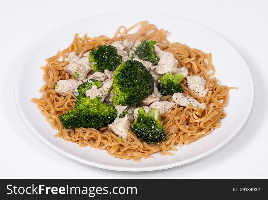 Stir fried Chinese Garlic Broccoli Chicken with egg noodles ready to serve. Stir fried Chinese Garlic Broccoli Chicken with egg noodles ready to serve