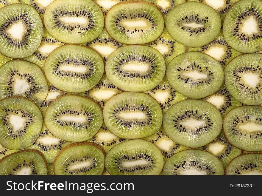 Sliced fresh kiwi fruit background. Sliced fresh kiwi fruit background