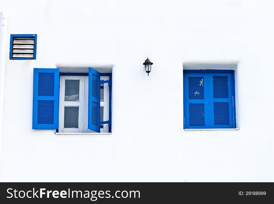 Twin blue window with white wall