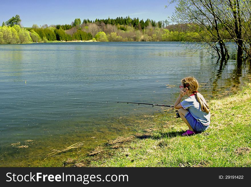 Little girl fishes on the lake. Little girl fishes on the lake