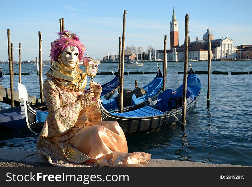 A venetian mask in front of San Giorgio isle