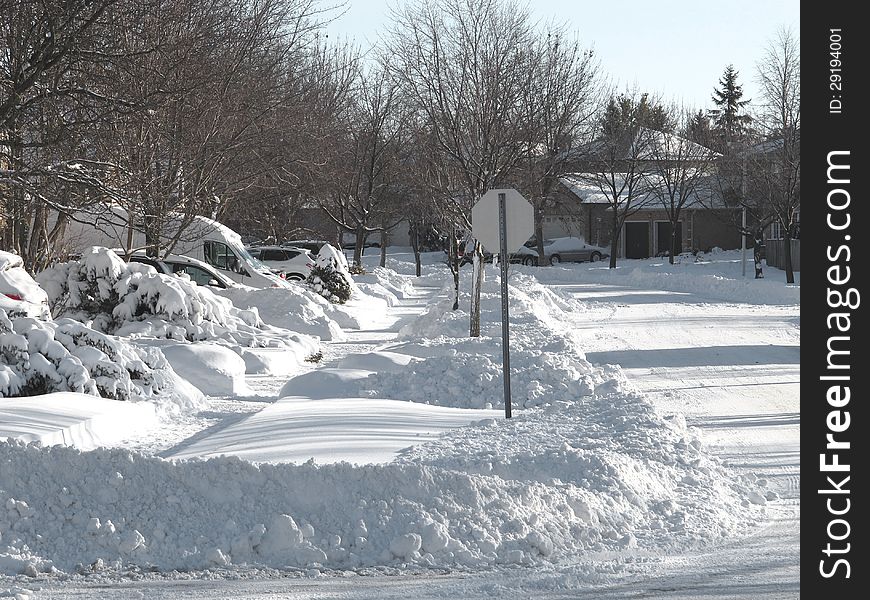 Sun shining on an urban city street after a heavy snowfall. Sun shining on an urban city street after a heavy snowfall.