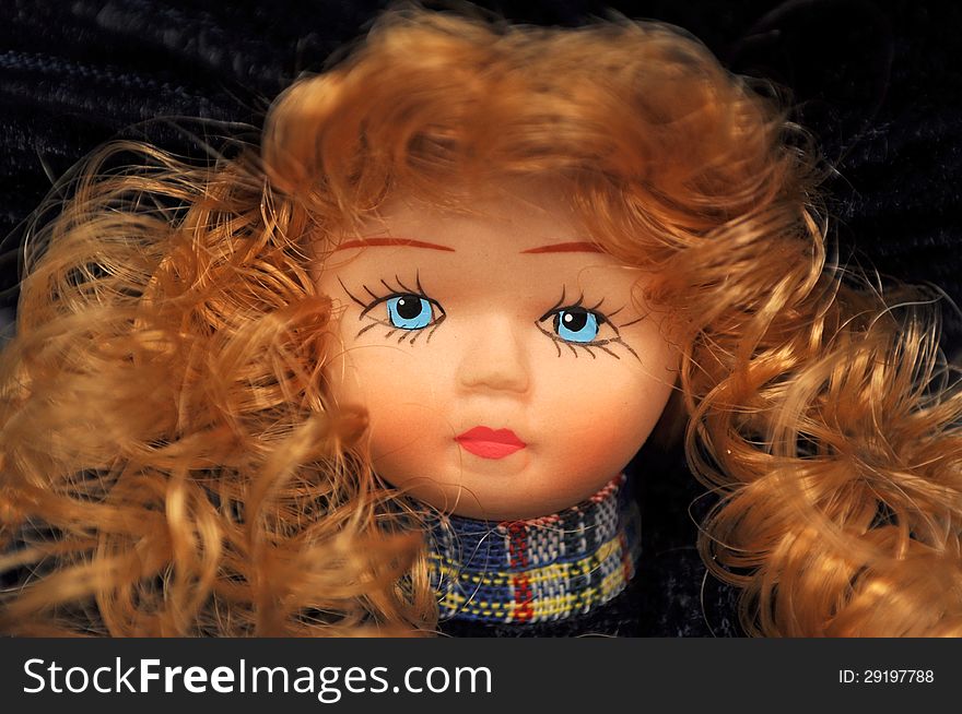 Elegant blue eyes doll face closeup. Elegant blue eyes doll face closeup