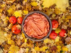 Round Wooden Basket For A Newborn Baby For Composite Photography, With A Blanket Inside, Stands On Orange Autumn Leaves Surrounded Royalty Free Stock Photo