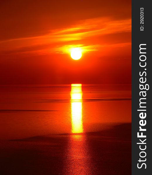 The sun rises early in the morning over lake Ontario. The sun rises early in the morning over lake Ontario.