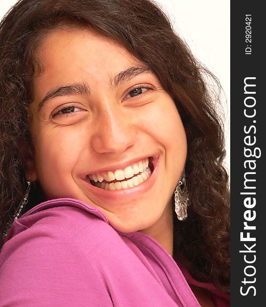 A close-up shot of the face of a pretty young girl with long dark hair
for white background an nice smiling. A close-up shot of the face of a pretty young girl with long dark hair
for white background an nice smiling.