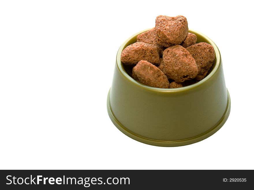 Green bowl with dog food isolated over white background. Green bowl with dog food isolated over white background.
