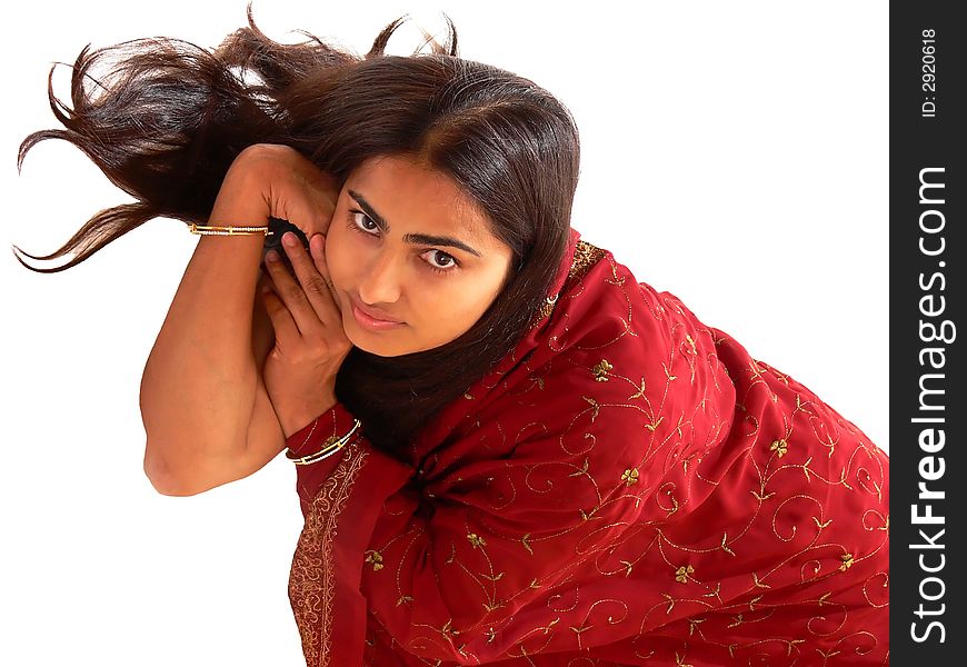 An beautiful indian lady in her native dress laying on the floor and the camera from above, on white background. An beautiful indian lady in her native dress laying on the floor and the camera from above, on white background.