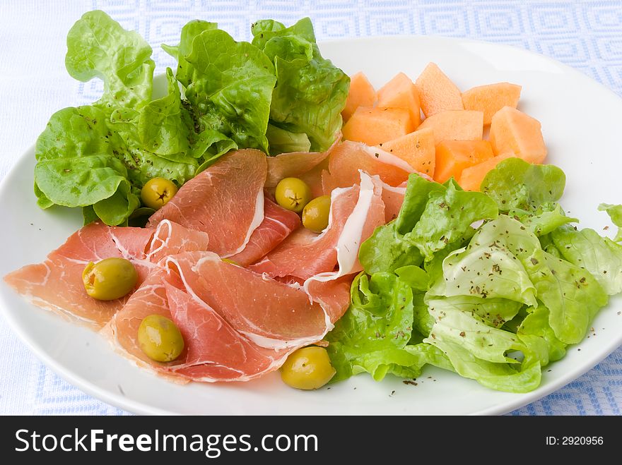 Prosciutto with fresh summer salad,carrots and olives. Prosciutto with fresh summer salad,carrots and olives.