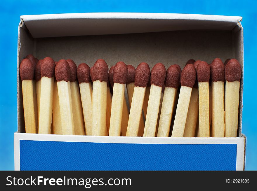 Box with matches on a dark blue background