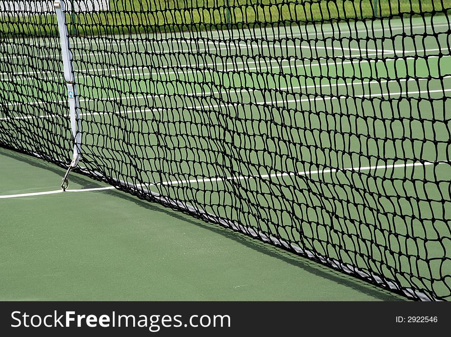 Tennis court netting spread across the court