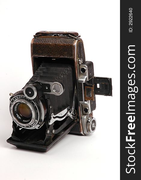 Old roll-film camera isolated on white