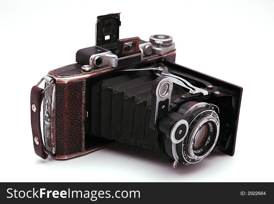 Old roll-film camera isolated on white