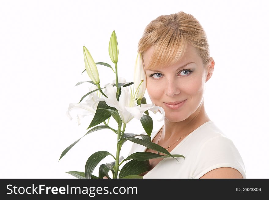 The attractive girl holds a lily in hands. The attractive girl holds a lily in hands