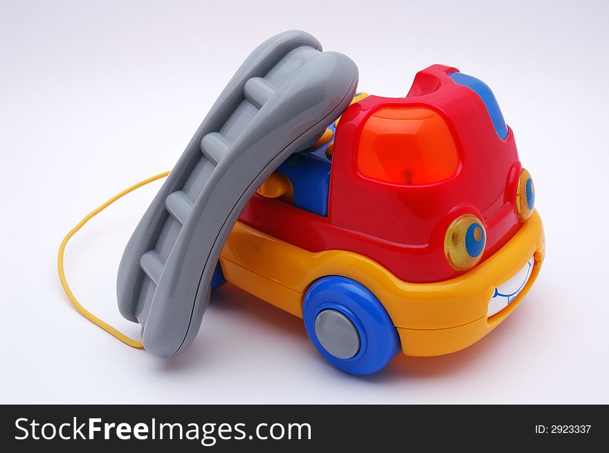Red car phone toy isolated on white