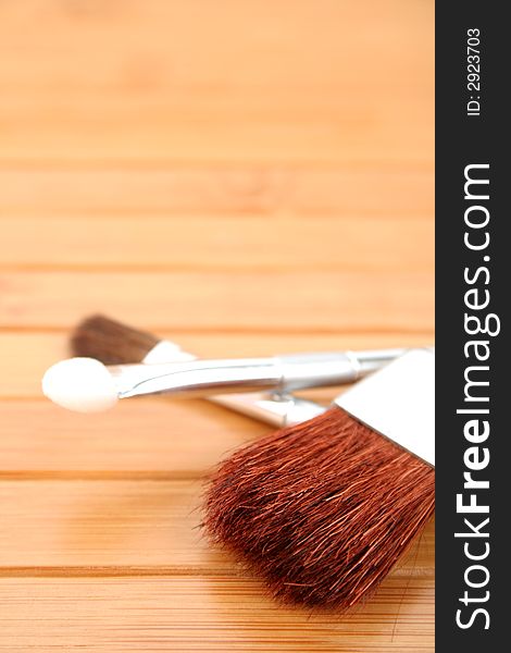 Makeup brushes on wooden carpet 3. Makeup brushes on wooden carpet 3