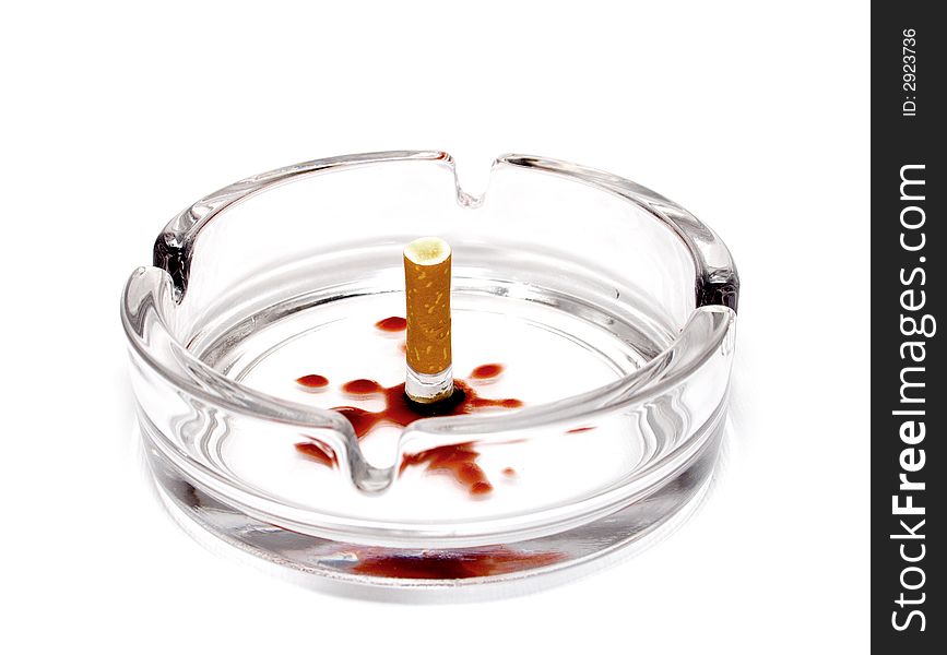 Blooded cigarette in ash-tray on white background. Blooded cigarette in ash-tray on white background