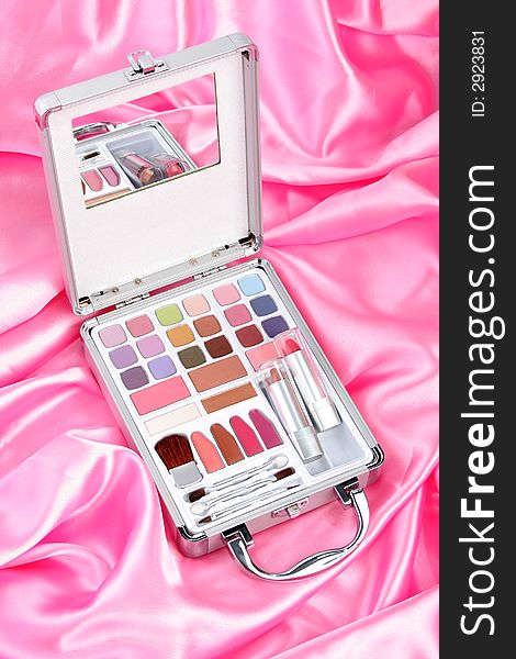 Makeup briefcase on pink satin 1