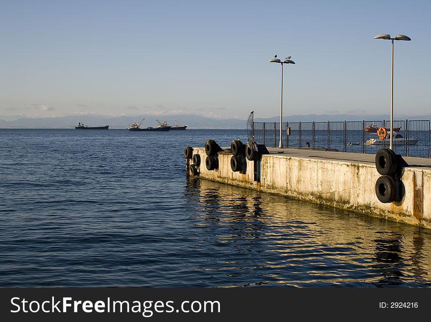 Seagulls and a wharf near Marmara Sea, transportation skips. Seagulls and a wharf near Marmara Sea, transportation skips