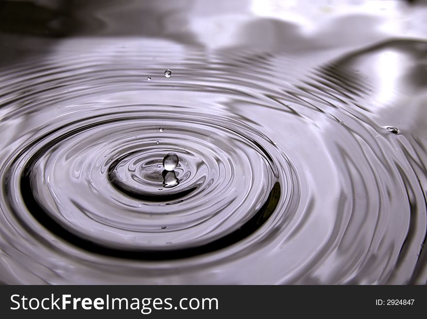 A very rare moment when the water drop is just touching the water surface, thanks to the early drop, the water surface strill have does nice circle waves and beatifull reflections. A very rare moment when the water drop is just touching the water surface, thanks to the early drop, the water surface strill have does nice circle waves and beatifull reflections.