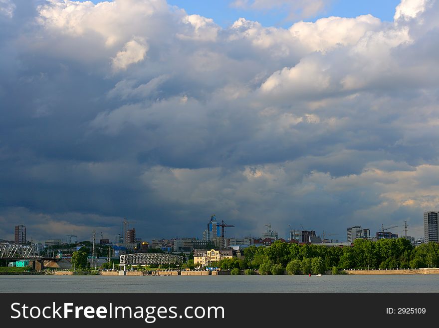 Cityscape before thunderstorm with dramatic and contrasts clouds. Cityscape before thunderstorm with dramatic and contrasts clouds